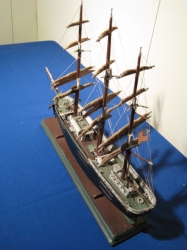 Three masted ship with furled sails